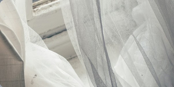 Sheer curtains gathered at a window